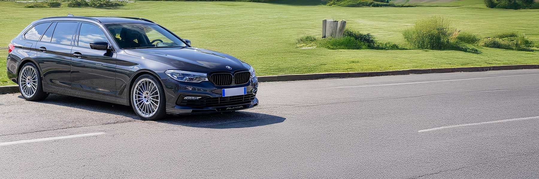 Banner image of a  Alpina B5 D5 G31 featuring original Alpina wheels.