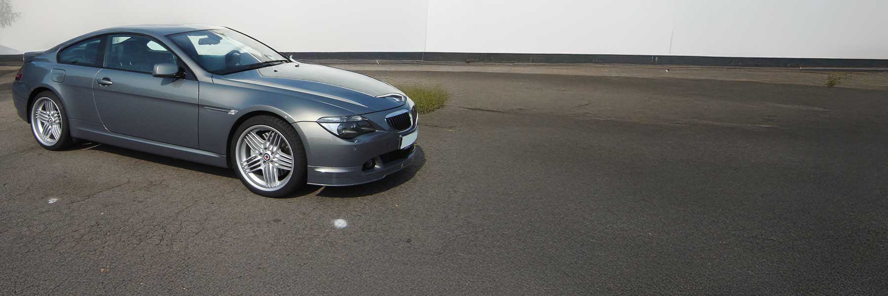 Banner image of a  Alpina B6 E63 featuring original Alpina wheels.