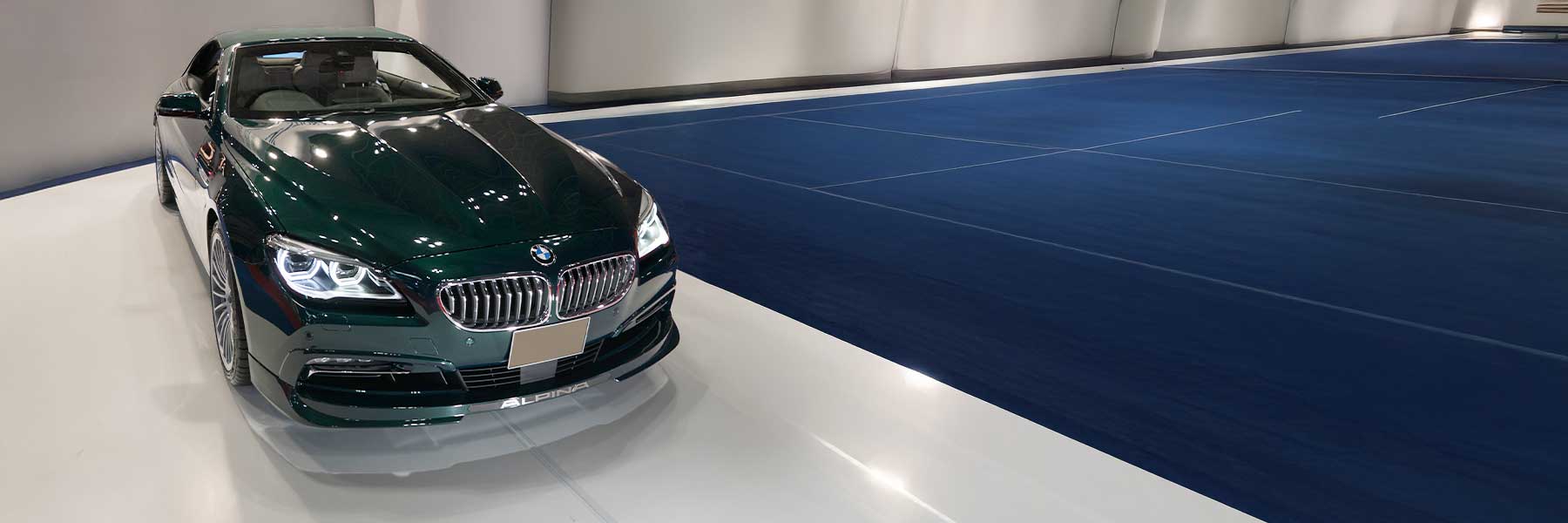 Banner image of a  Alpina B6 F13 featuring original Alpina wheels.
