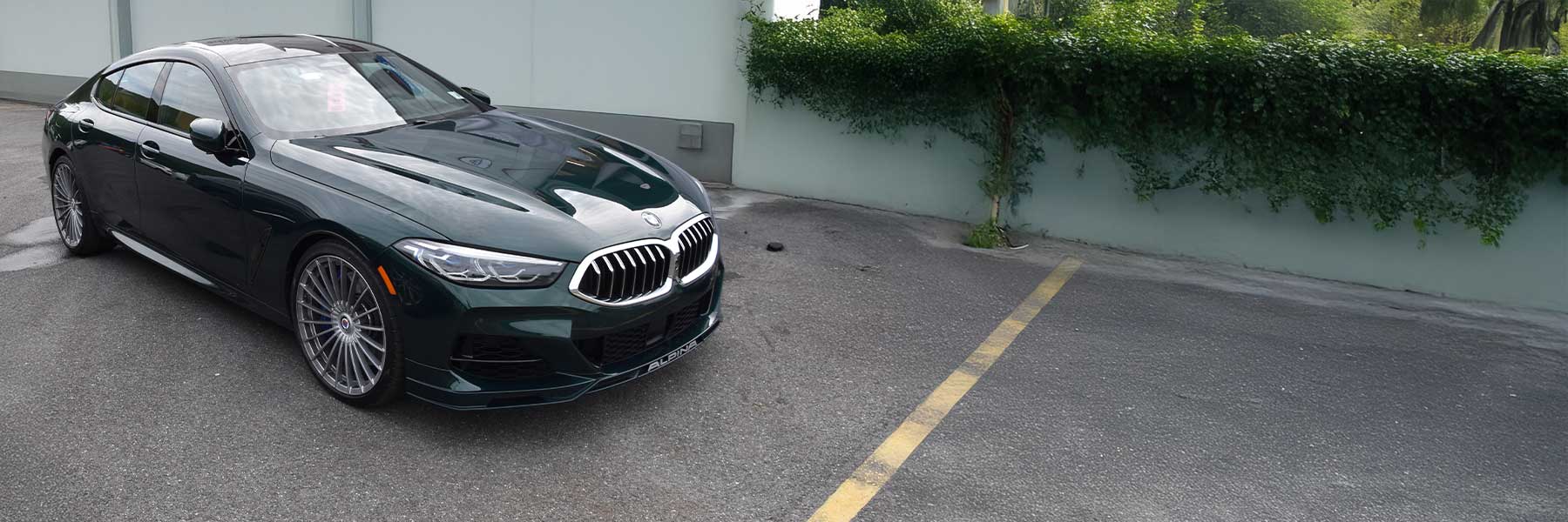 Banner image of a  Alpina B8 G16 featuring original Alpina wheels.