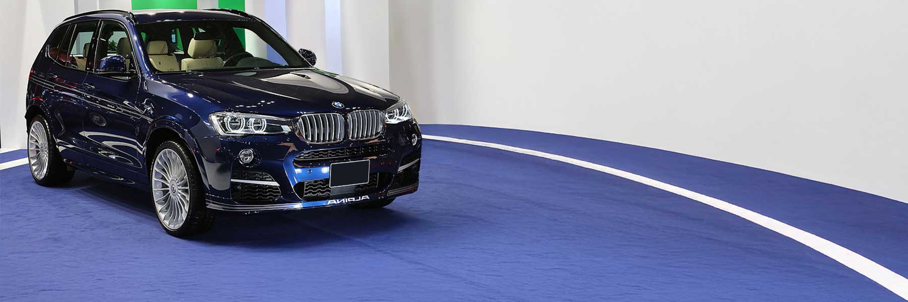 Banner image of a  Alpina XD3 F25 featuring original Alpina wheels.