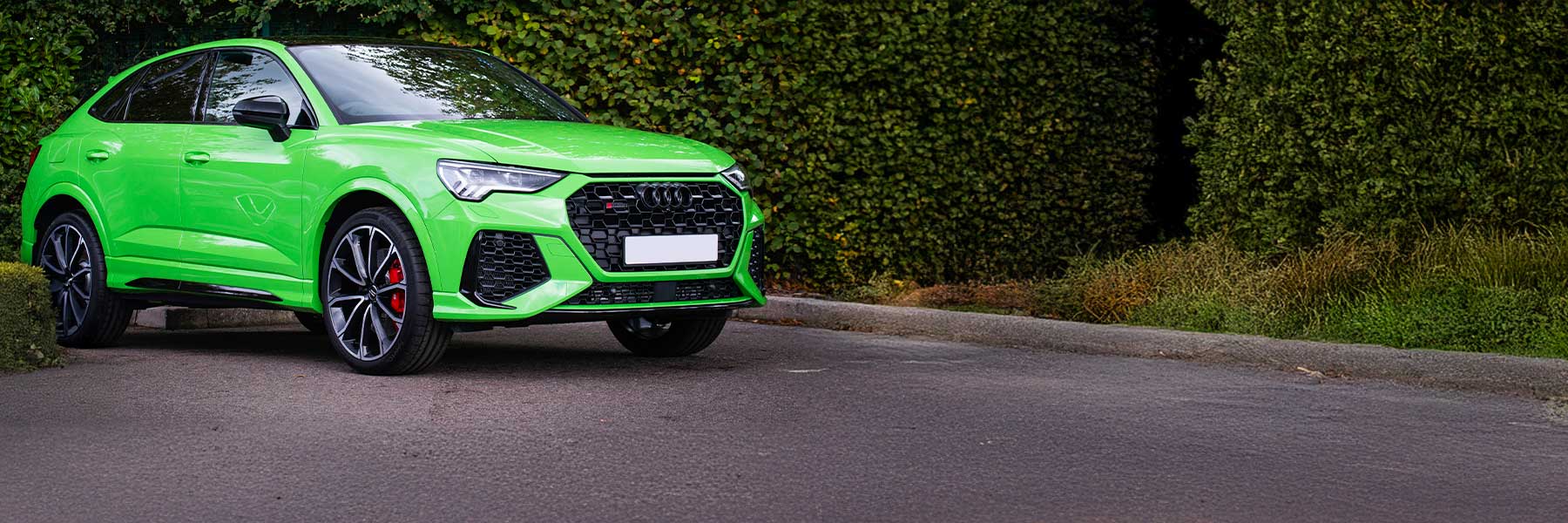 Banner image of a  Audi RS Q3 83A F3 featuring original Audi wheels.