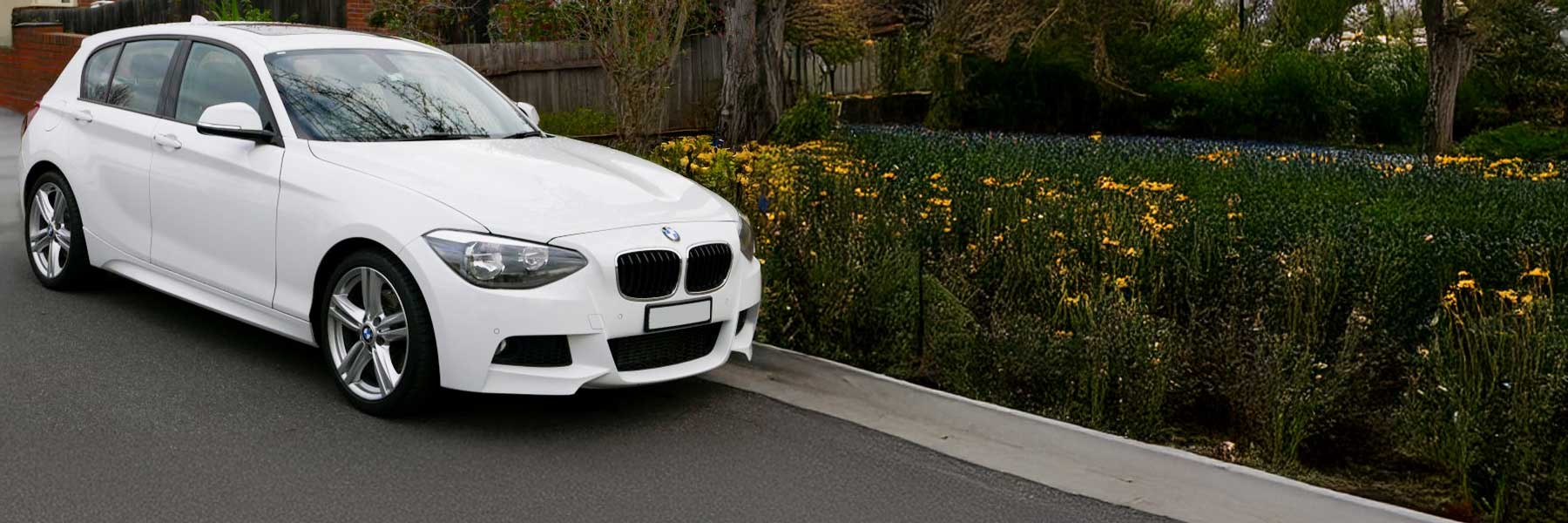 Banner image of a  BMW 1 Series F21 featuring original BMW wheels.