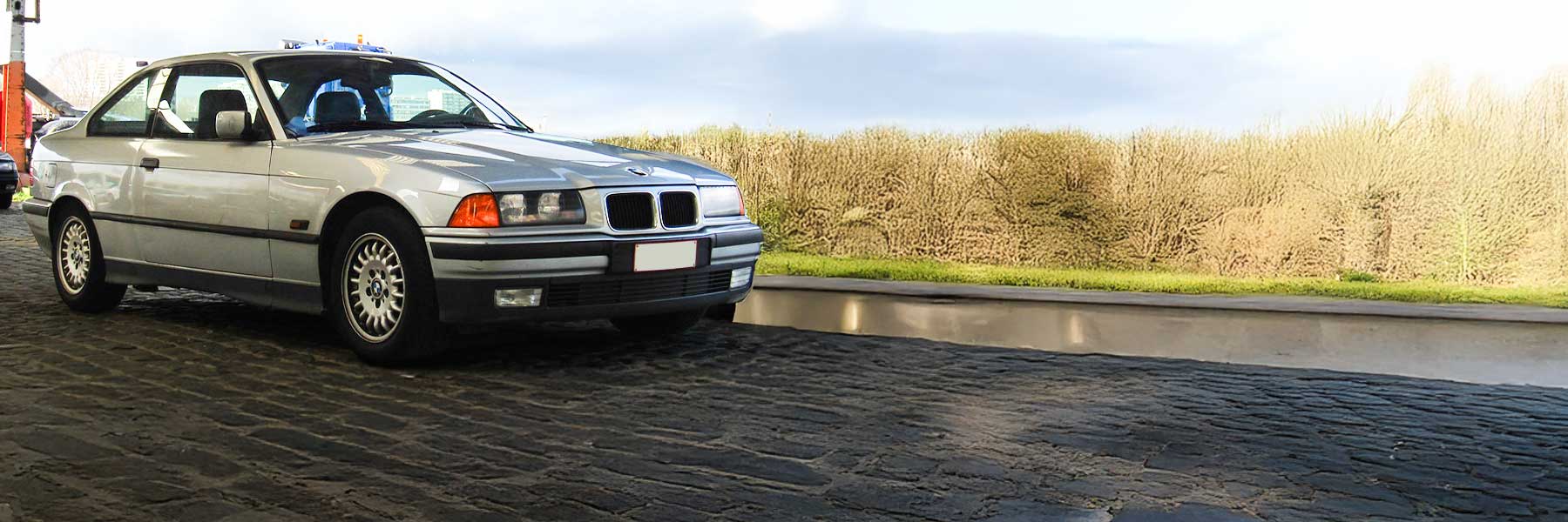 Banner image of a  BMW 3 Series E36 featuring original BMW wheels.