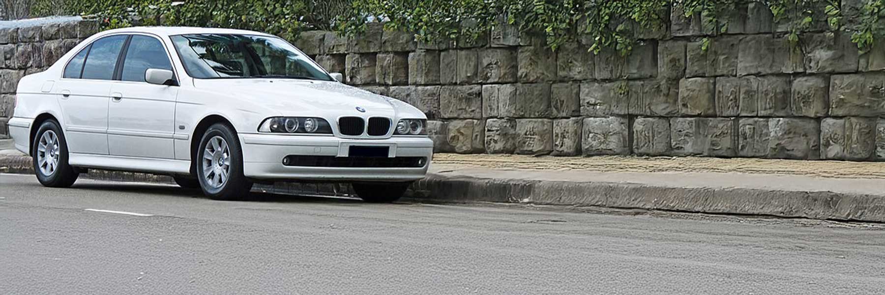 Banner image of a  BMW 5 Series E39 featuring original BMW wheels.