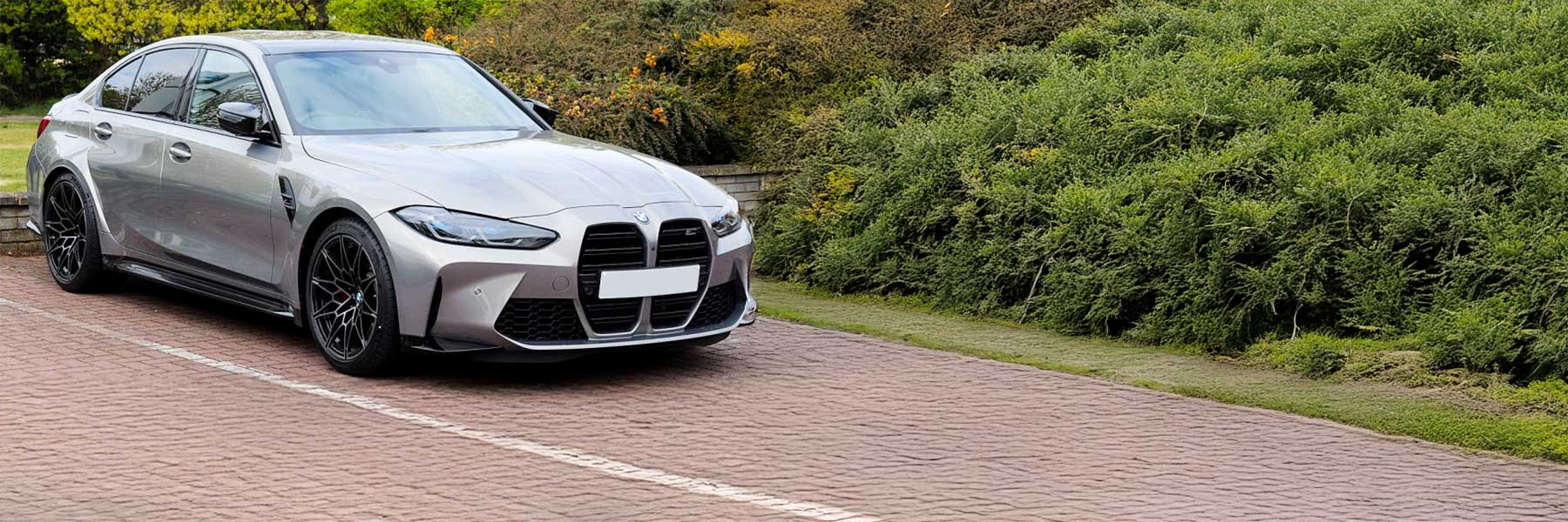 Banner image of a  BMW M3 G80 featuring original BMW wheels.