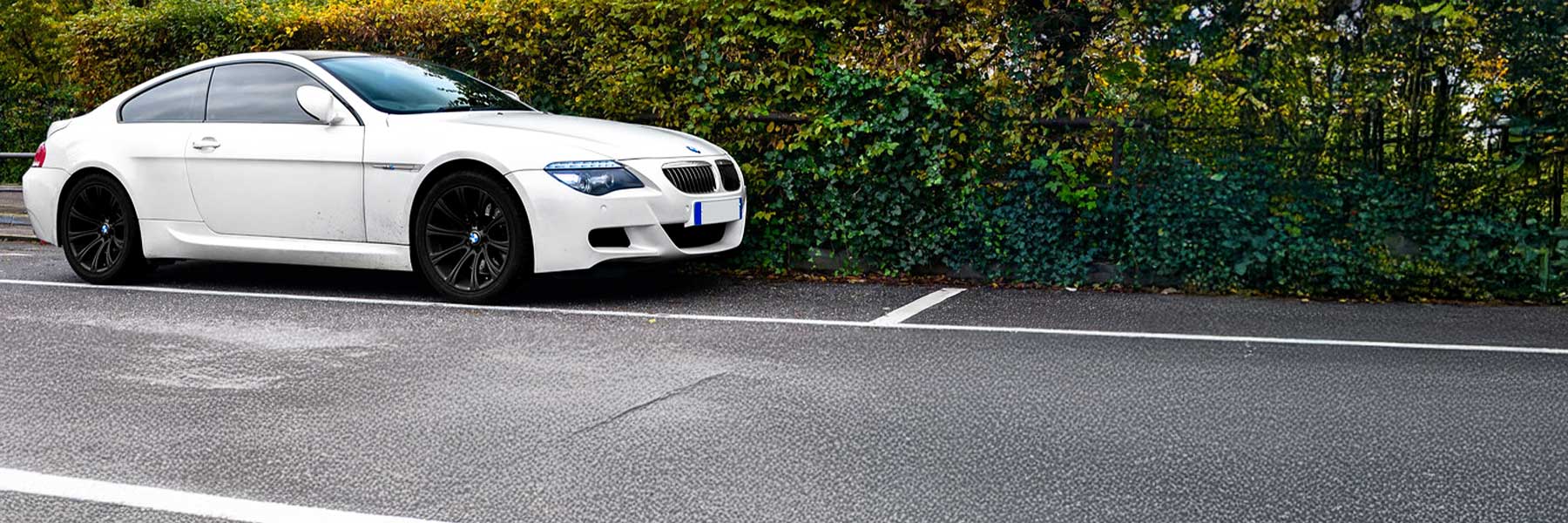 Banner image of a  BMW M6 E63 featuring original BMW wheels.