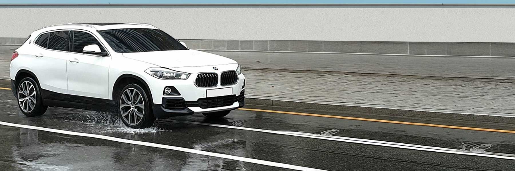 Banner image of a  BMW X2 F39 featuring original BMW wheels.