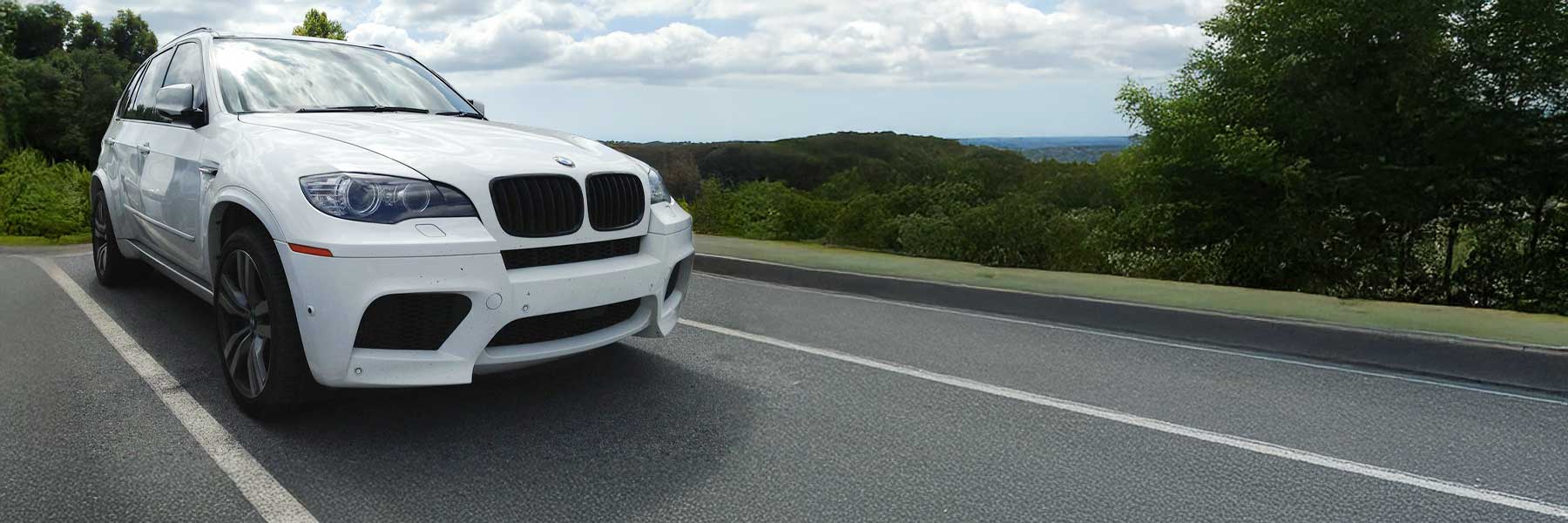 Banner image of a  BMW X5 M E70 featuring original BMW wheels.