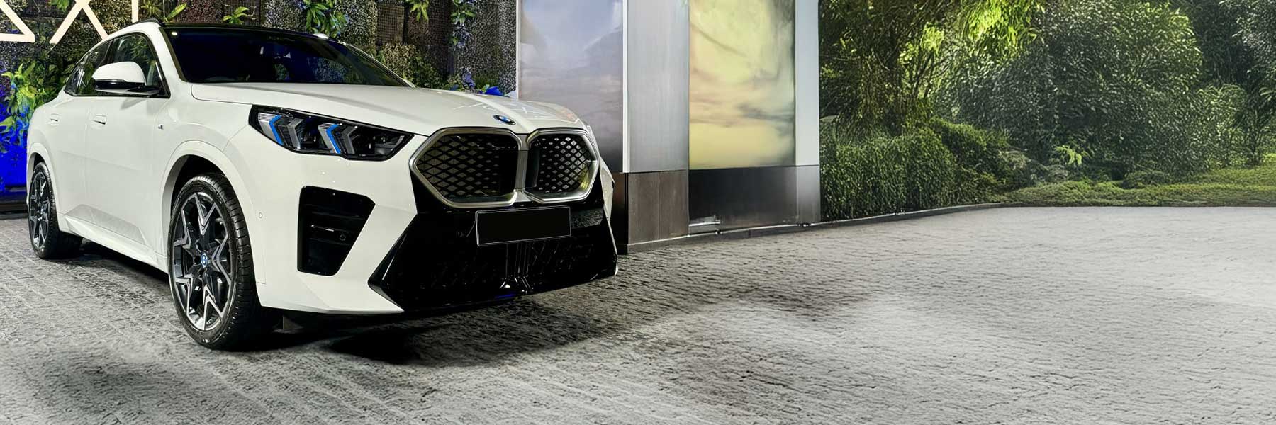 Banner image of a  BMW iX2 U10 featuring original BMW wheels.