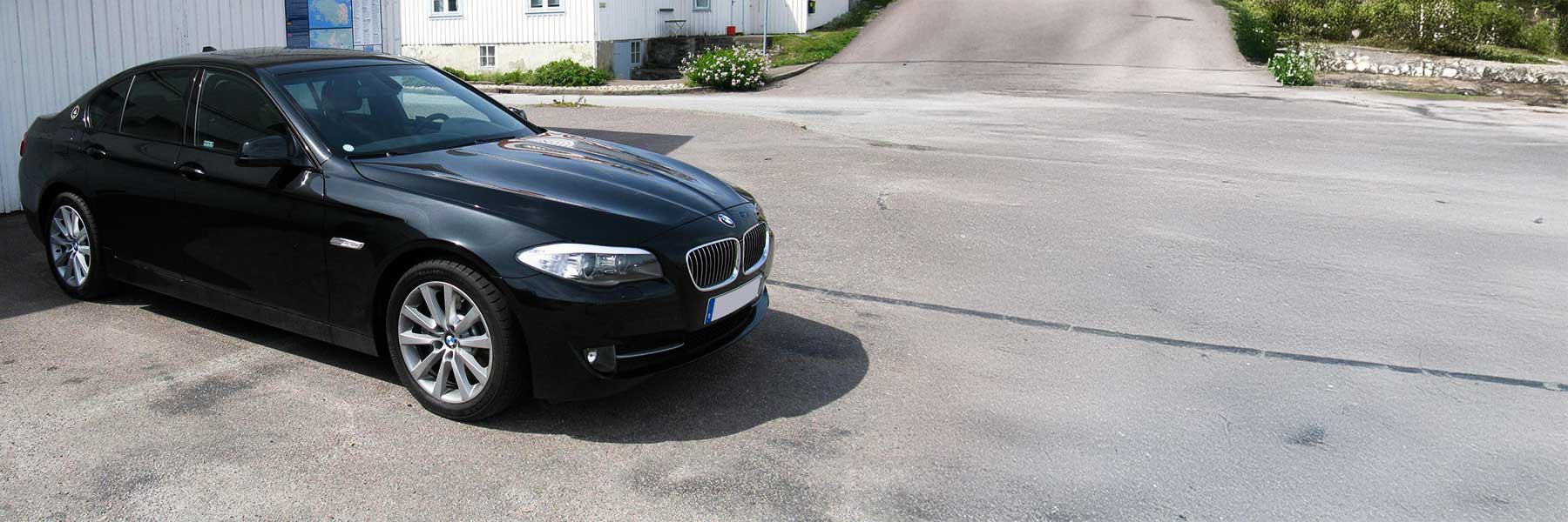 Banner image of a  BMW 5 Series F10 featuring original BMW wheels.