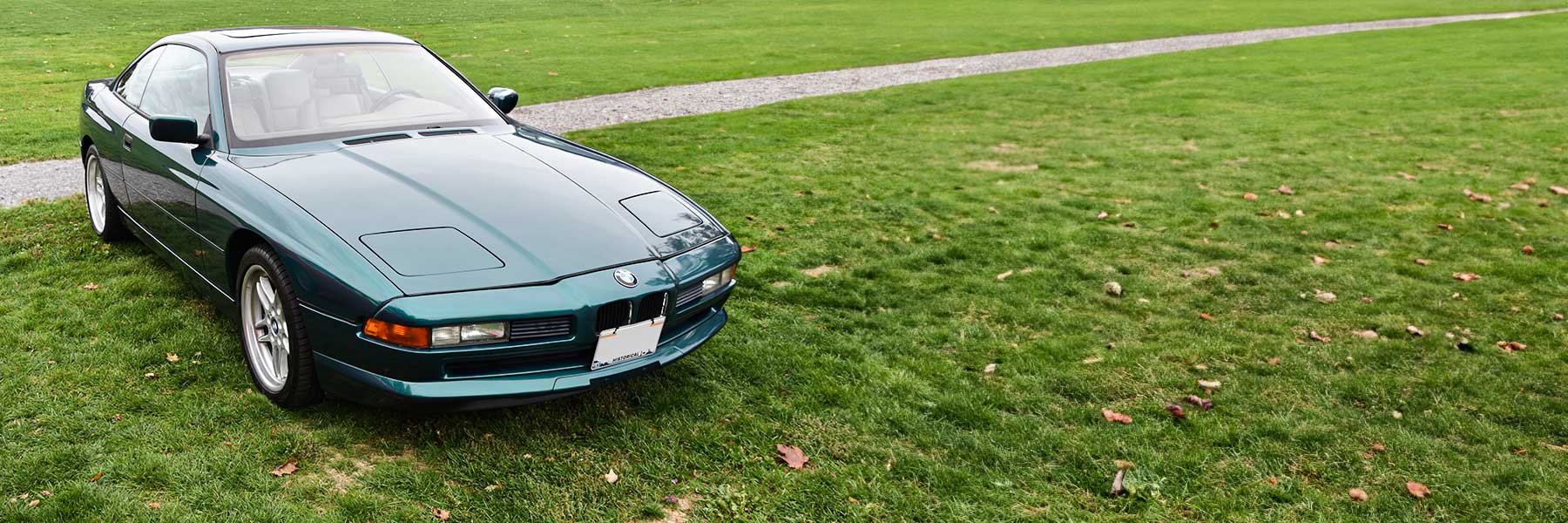Banner image of a  BMW 8 Series E31 featuring original BMW wheels.
