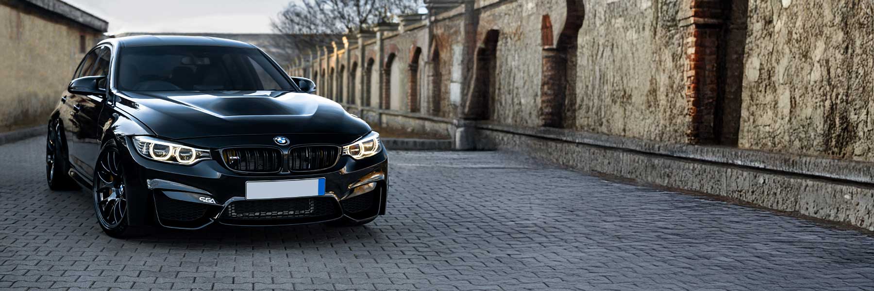 Banner image of a  BMW M4 F83 featuring original BMW wheels.