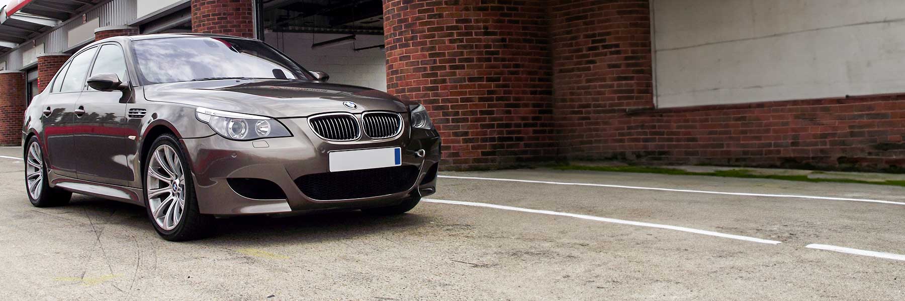 Banner image of a  BMW M5 E60 featuring original BMW wheels.