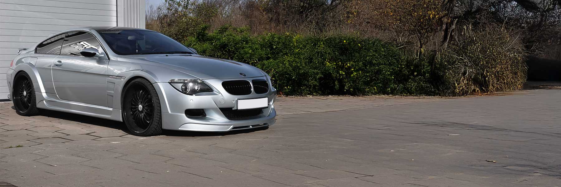 Banner image of a  BMW 6 Series E63 featuring original BMW wheels.