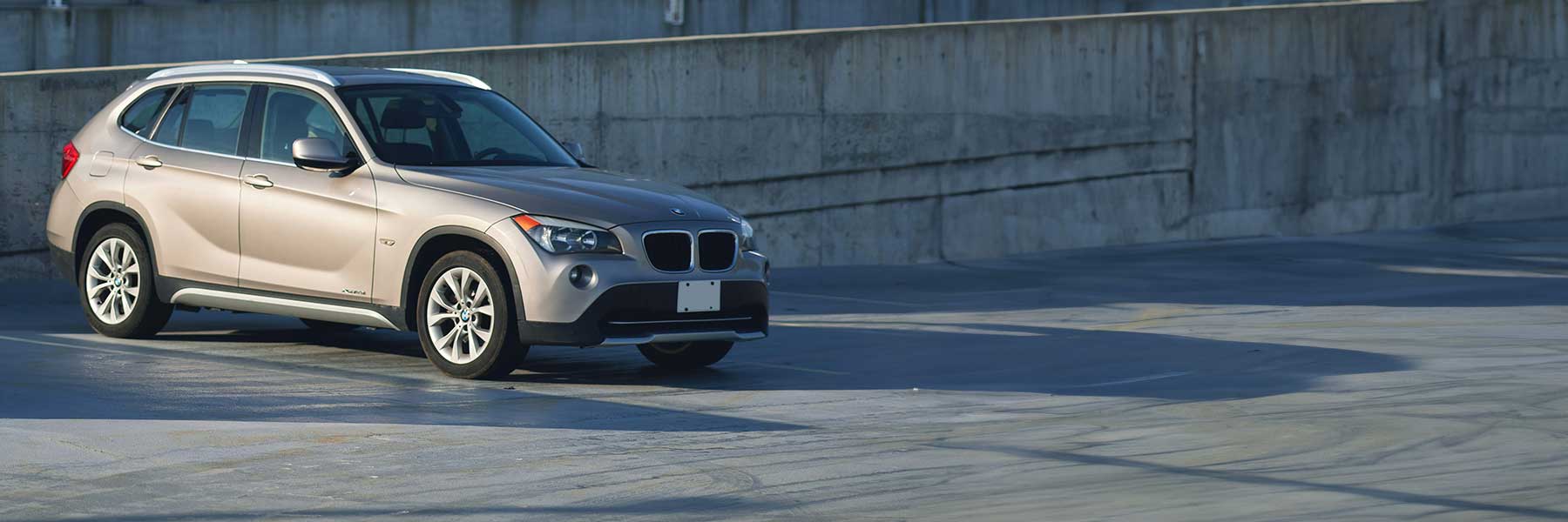 Banner image of a  BMW X1 E84 featuring original BMW wheels.