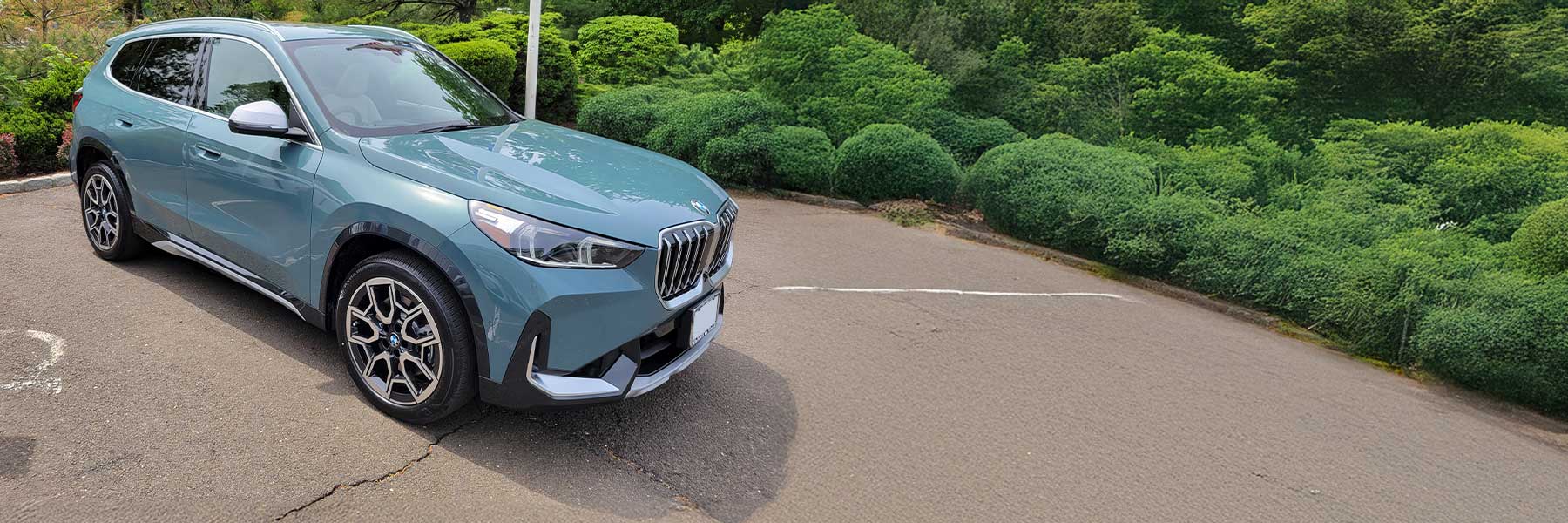 Banner image of a  BMW X1 U11 featuring original BMW wheels.