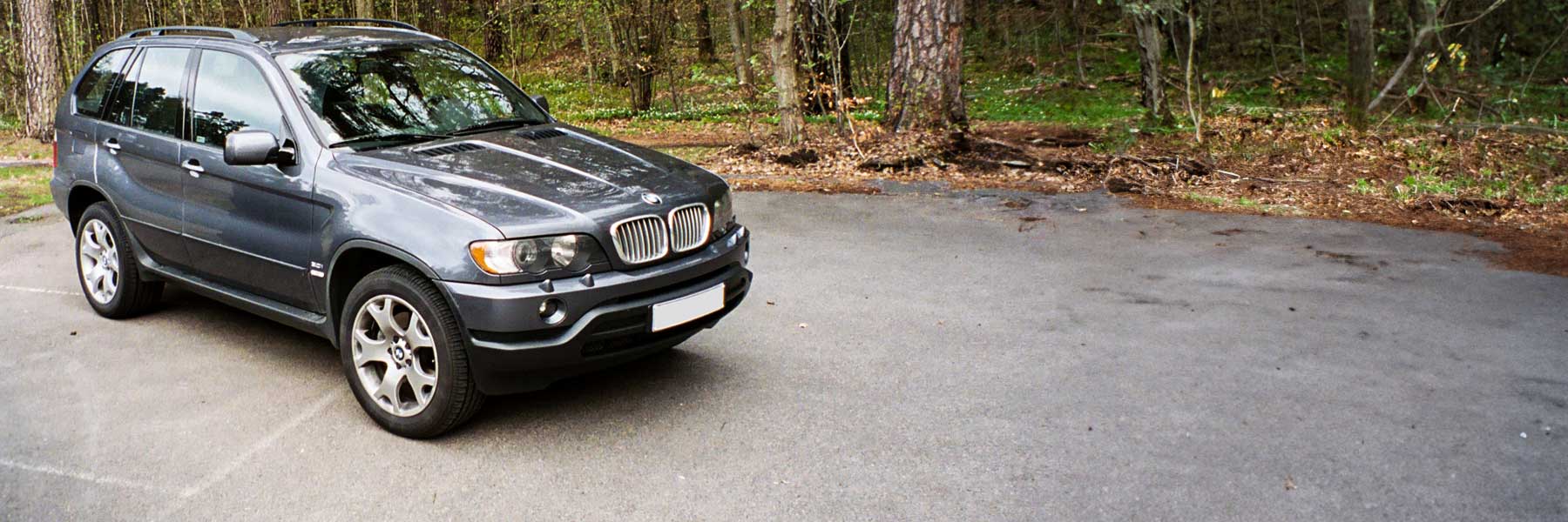 Banner image of a  BMW X5 E53 featuring original BMW wheels.