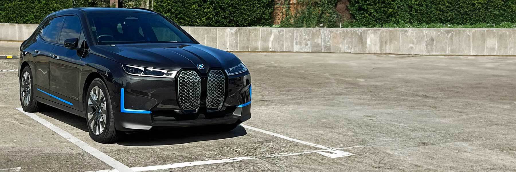 Banner image of a  BMW iX I20 featuring original BMW wheels.