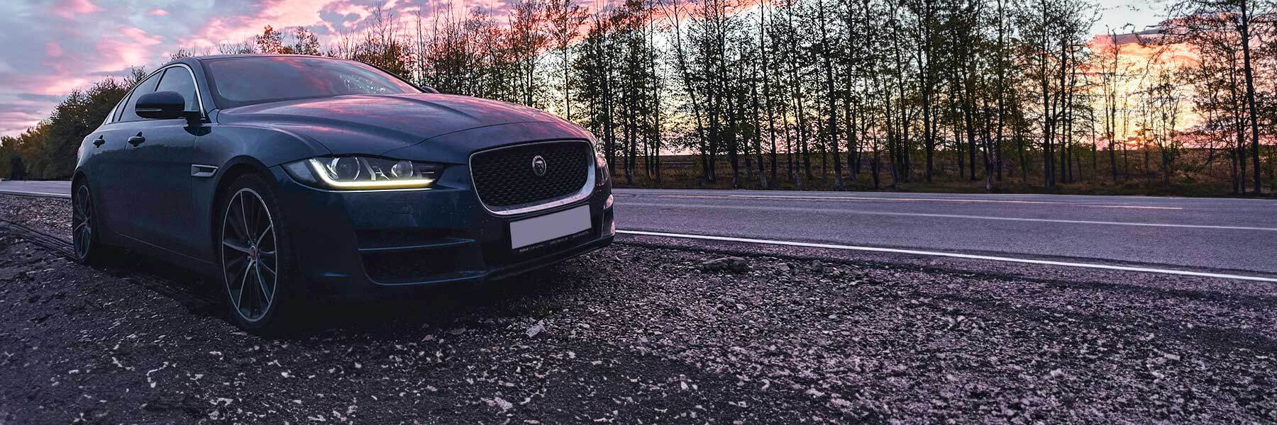 Banner image of a  Jaguar XE X760 featuring original Jaguar wheels.