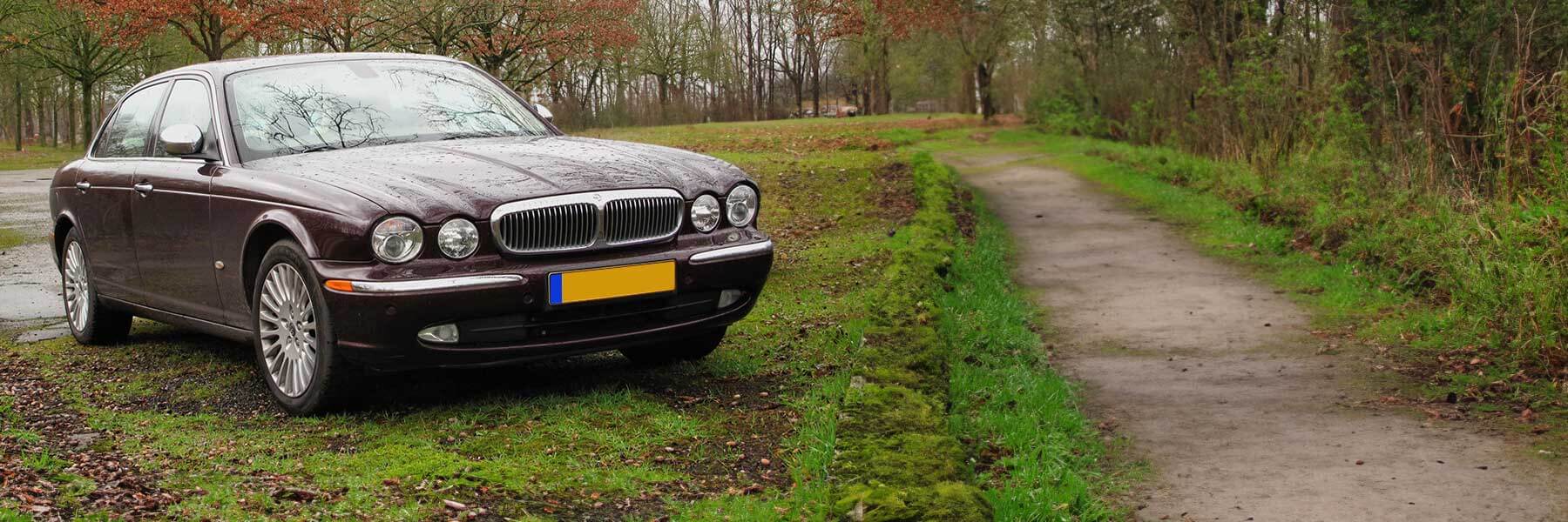 Banner image of a  Jaguar XJ X350 featuring original Jaguar wheels.