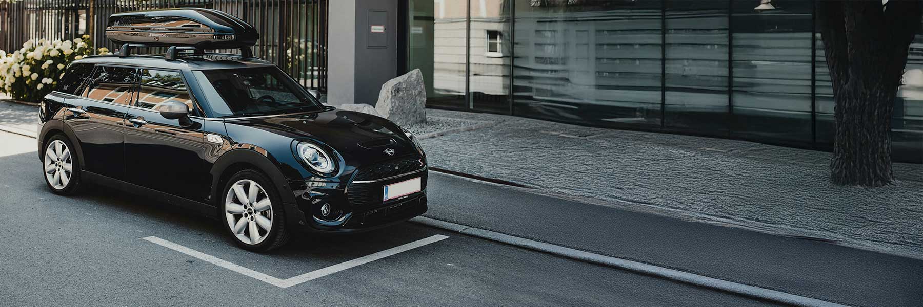 Banner image of a  MINI Hatchback F55 featuring original MINI wheels.