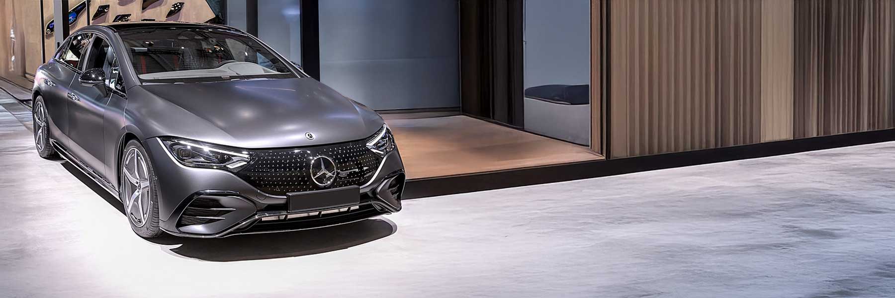 Banner image of a  Mercedes EQE V295 featuring original Mercedes wheels.