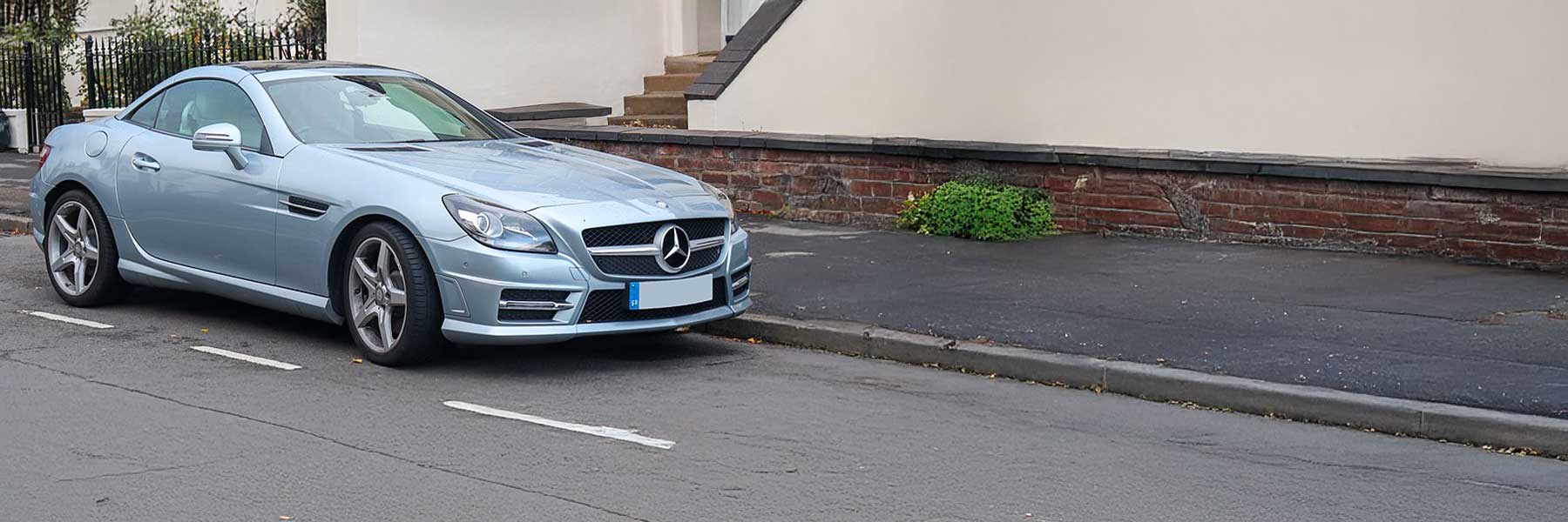 Banner image of a  Mercedes SLK R172 featuring original Mercedes wheels.