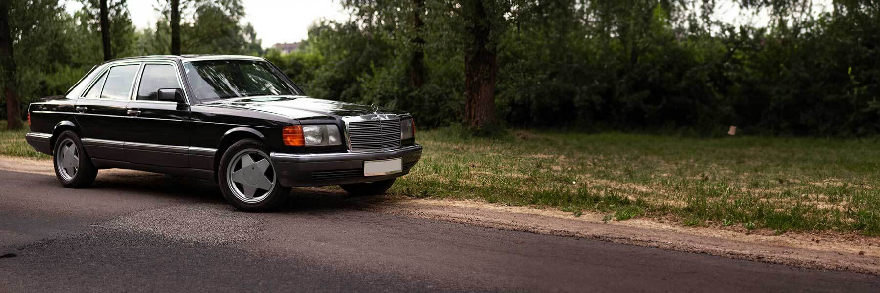 Banner image of a  Mercedes 190 W201 featuring original Mercedes wheels.