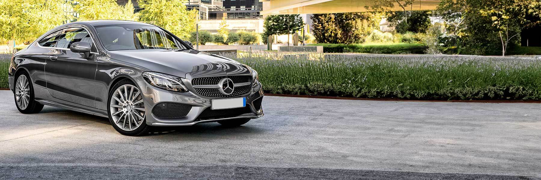 Banner image of a  Mercedes C-Class C205 featuring original Mercedes wheels.