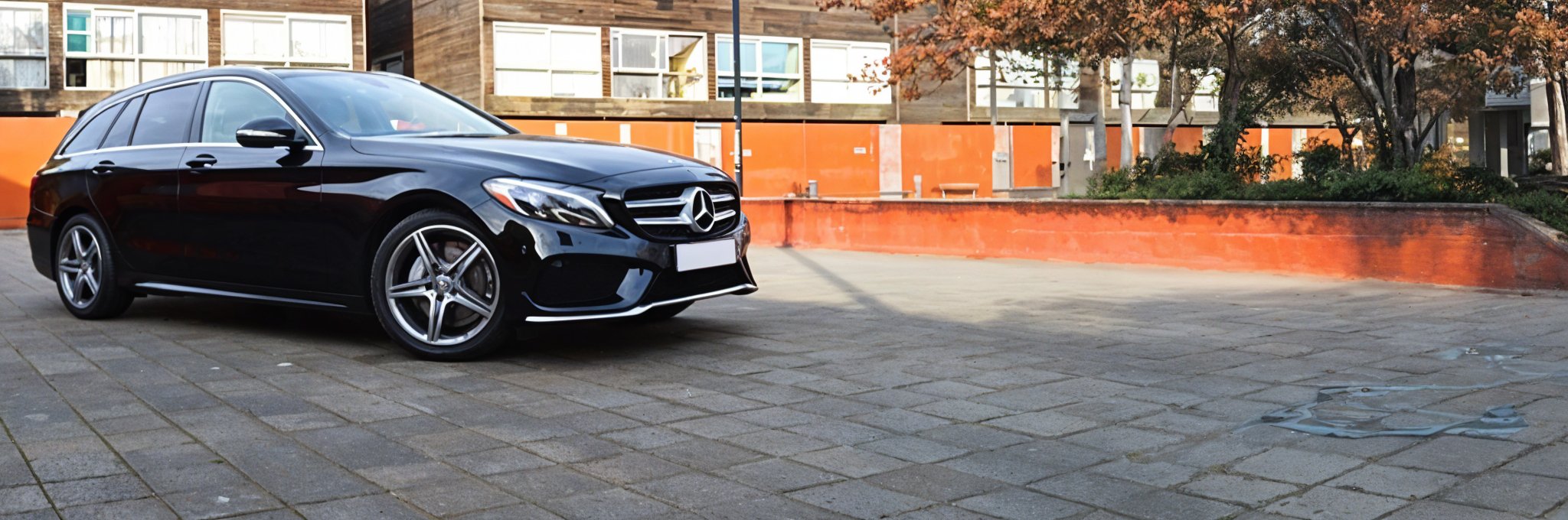 Banner image of a  Mercedes C-Class S205 featuring original Mercedes wheels.