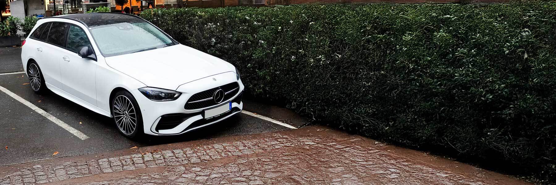 Banner image of a  Mercedes C-Class S206 featuring original Mercedes wheels.
