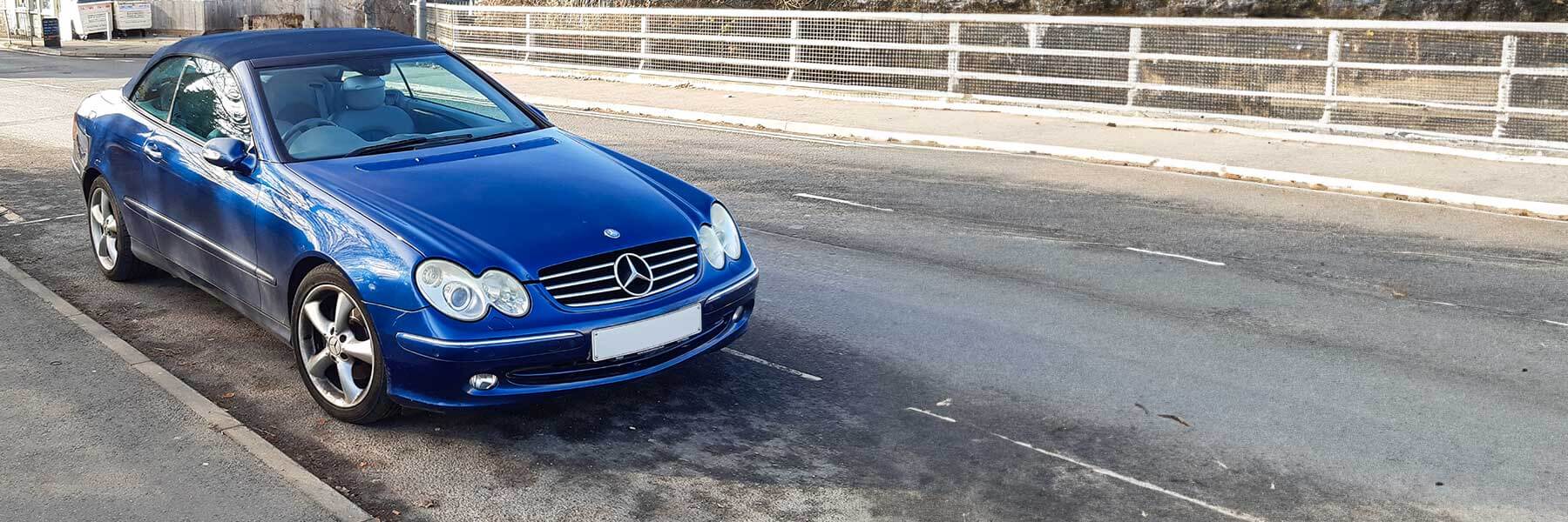 Banner image of a  Mercedes CLK A209 featuring original Mercedes wheels.