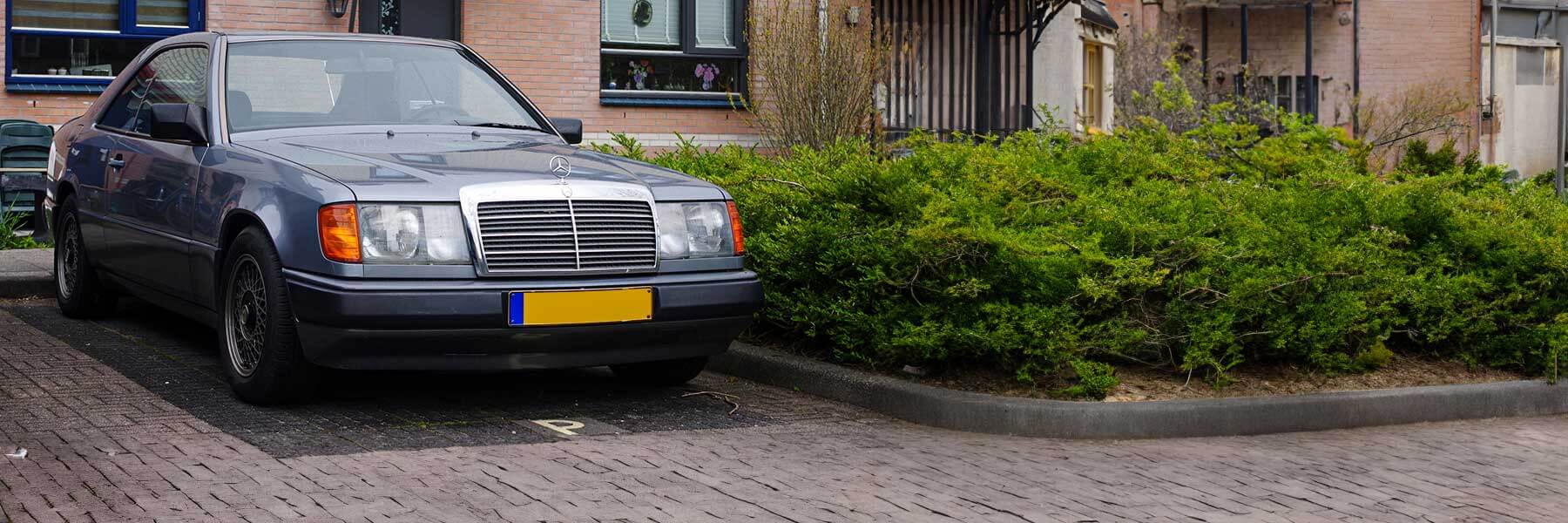 Banner image of a  Mercedes E-Class C124 featuring original Mercedes wheels.