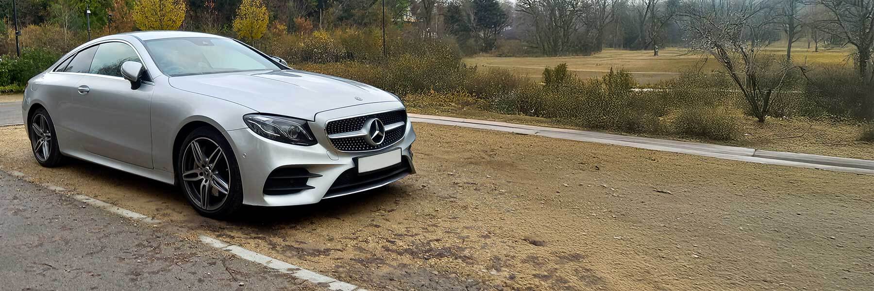 Banner image of a  Mercedes E-Class C238 featuring original Mercedes wheels.