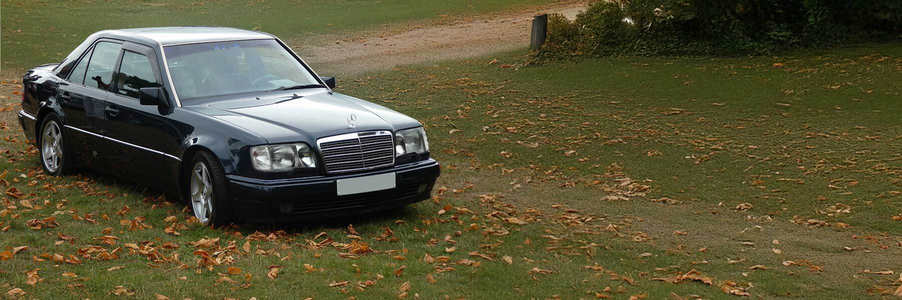 Banner image of a  Mercedes E-Class V124 featuring original Mercedes wheels.