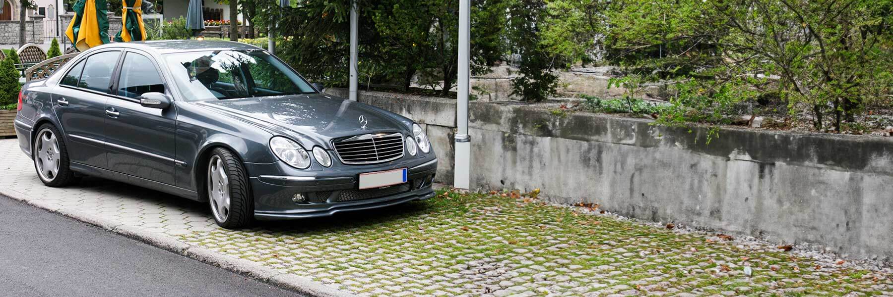 Banner image of a  Mercedes E-Class W211 featuring original Mercedes wheels.