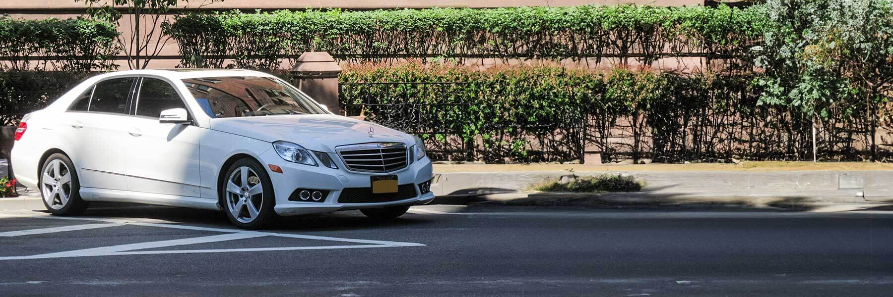 Banner image of a  Mercedes E-Class W212 featuring original Mercedes wheels.