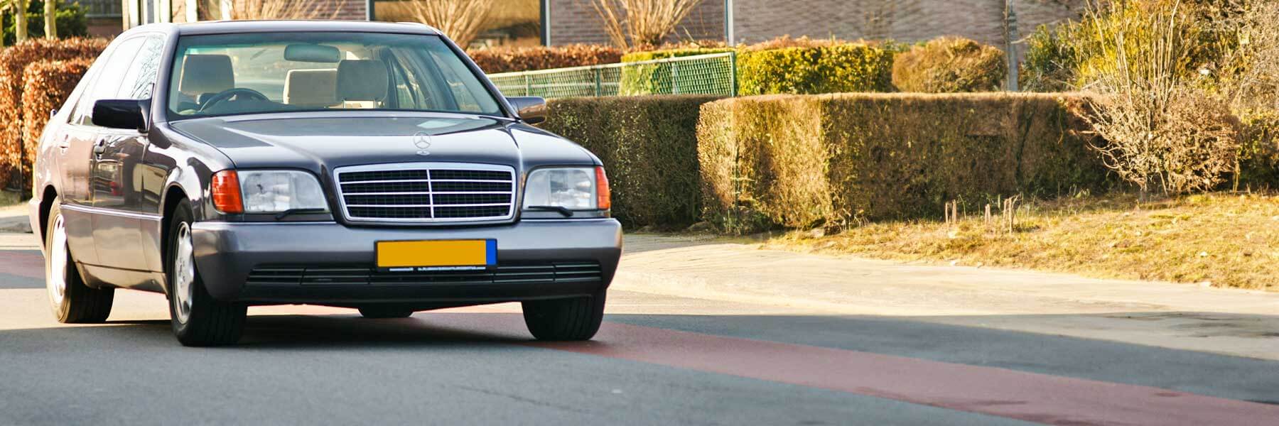 Banner image of a  Mercedes S-Class W140 featuring original Mercedes wheels.