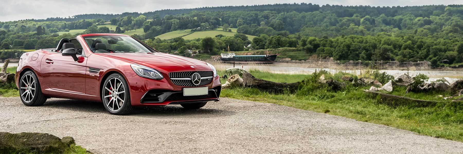 Banner image of a  Mercedes SLC R172 featuring original Mercedes wheels.