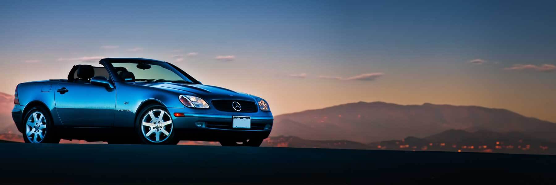 Banner image of a  Mercedes SLK R170 featuring original Mercedes wheels.