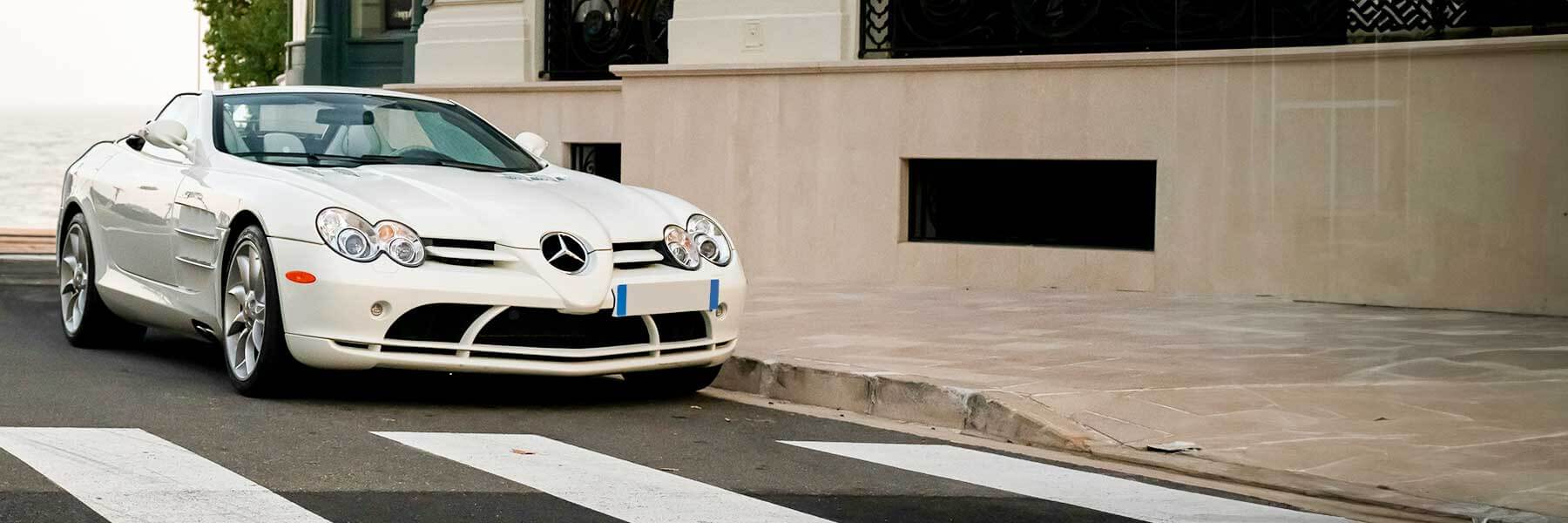 Banner image of a  Mercedes SLR R199 featuring original Mercedes wheels.