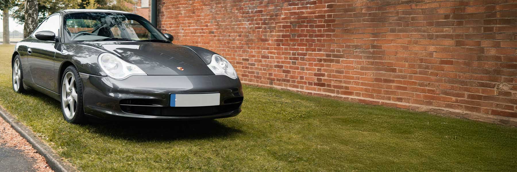 Banner image of a  Porsche 996 (911) 996 featuring original Porsche wheels.