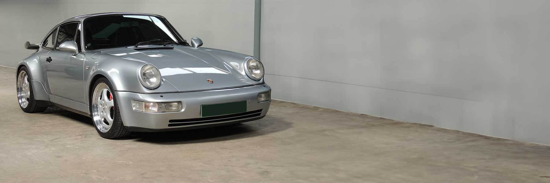 Banner image of a  Porsche 964 (911) 964 featuring original Porsche wheels.