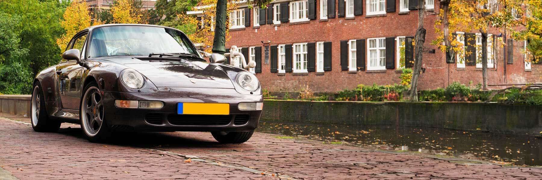 Banner image of a  Porsche 993 (911) 993 featuring original Porsche wheels.