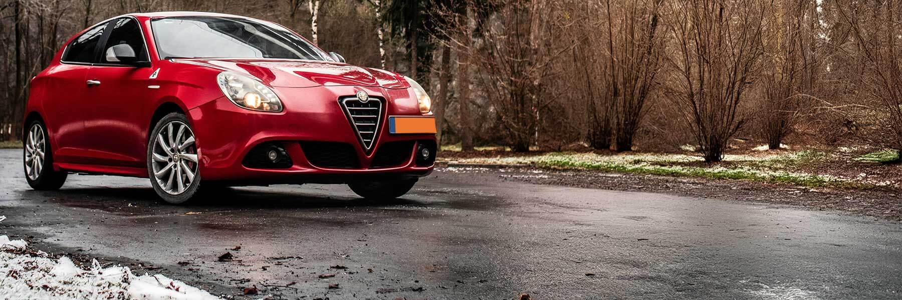 Alfa Romeo featured in banner showcasing its original alloy wheels.