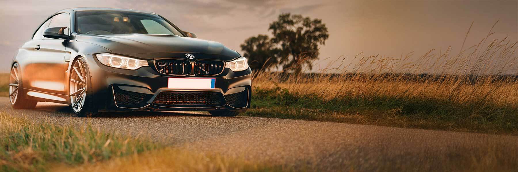 BMW featured in banner showcasing its original alloy wheels.