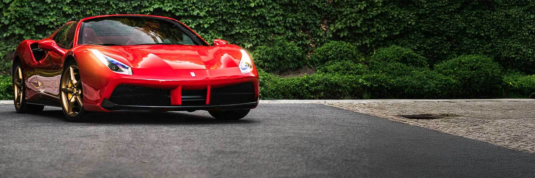 Ferrari featured in banner showcasing its original alloy wheels.