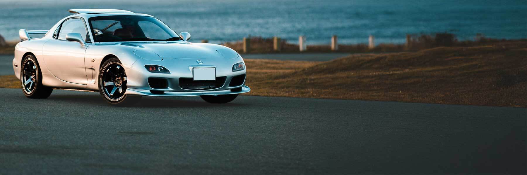 Banner image of a  Mazda CX-5 KE/GH featuring original Mazda wheels.