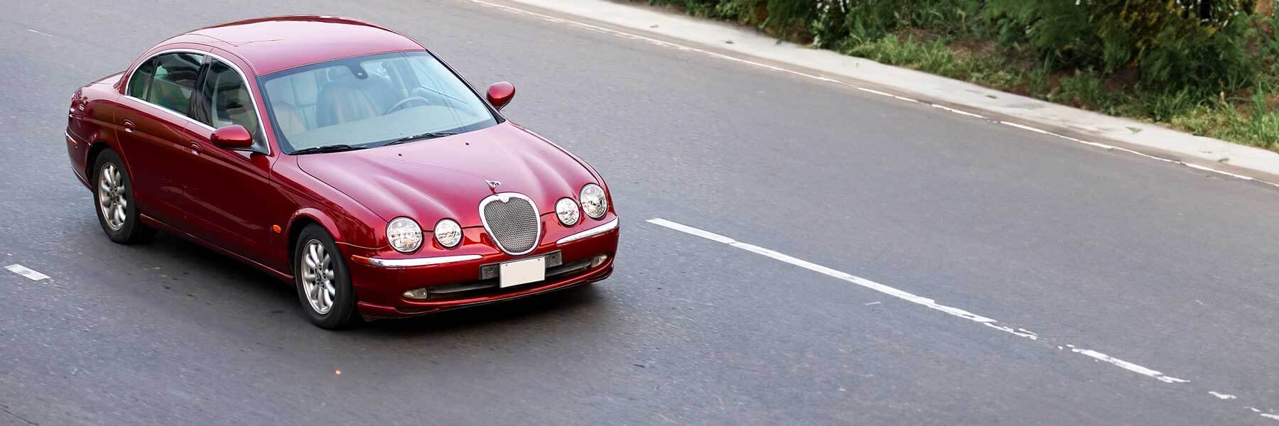 Featured banner showcasing the Jaguar S-Type with original Jaguar wheels.